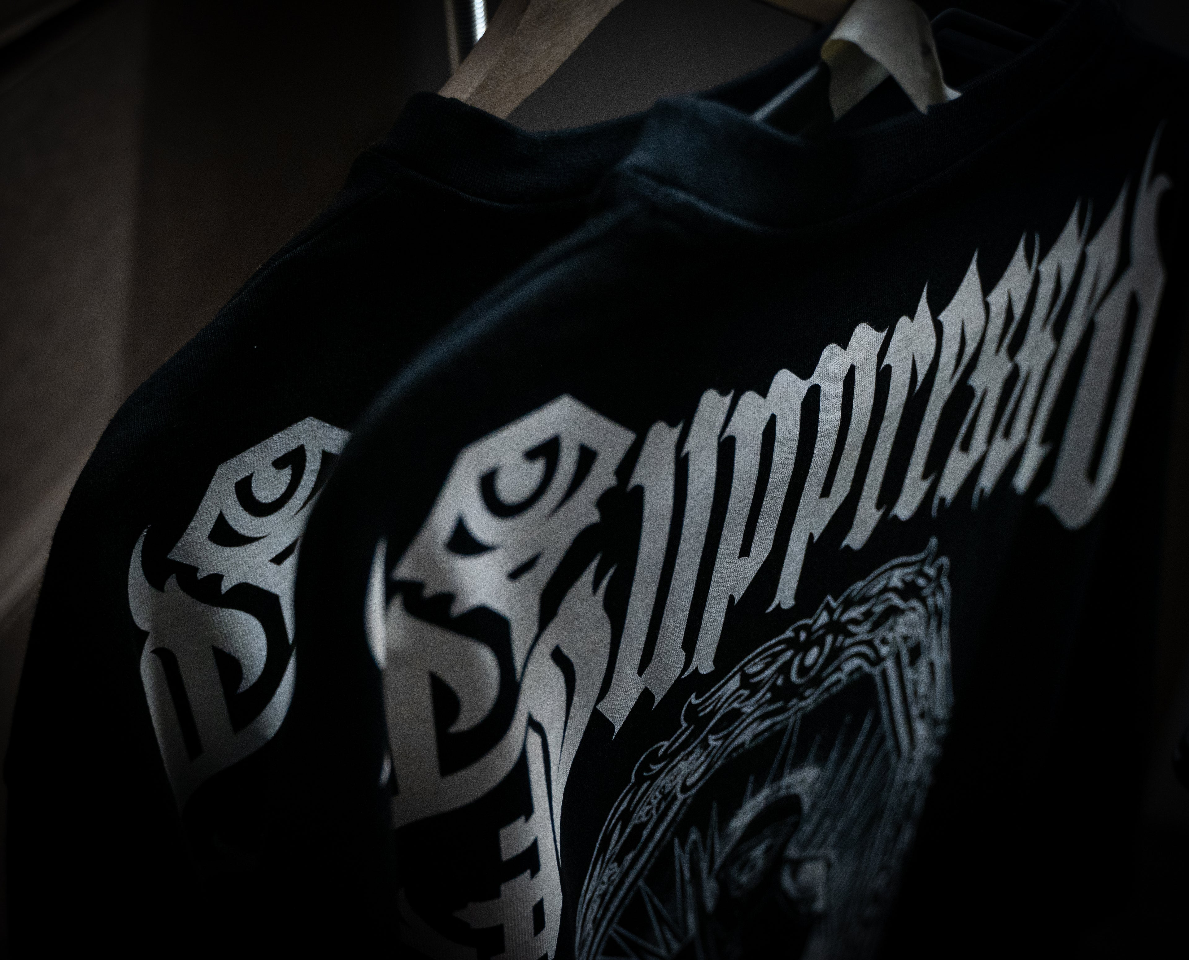 Suppressed t shirts with the Monk design printed in white on black fabric